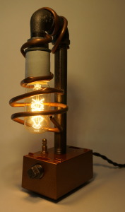 The smallest of our pipe lamps. Features hand wrapped copper lamp shade, edison bulb, and industrial fittings.